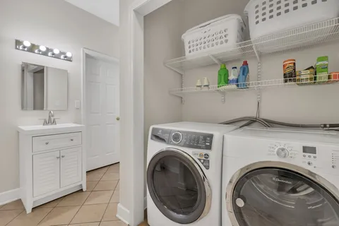 a front view of a house with yard and green space