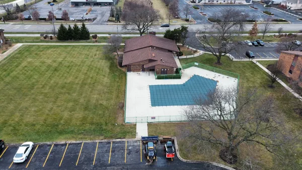 an aerial view of a house with a garden