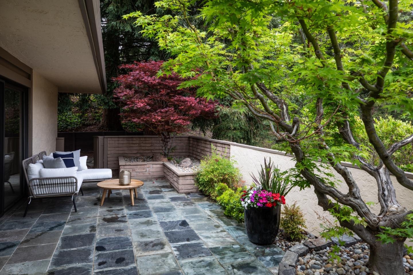 22415 Rancho Deep Cliff Drive Cupertino, CA 95014 - Photo 23 of 33 a view of a chair and table in the garden