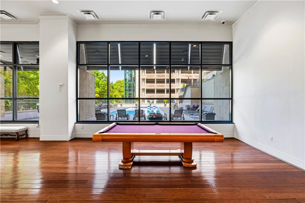 3040 Peachtree Road Northwest, Unit 1503 Atlanta, GA 30305 - Photo 33 of 38 a room with wooden floor and pool table