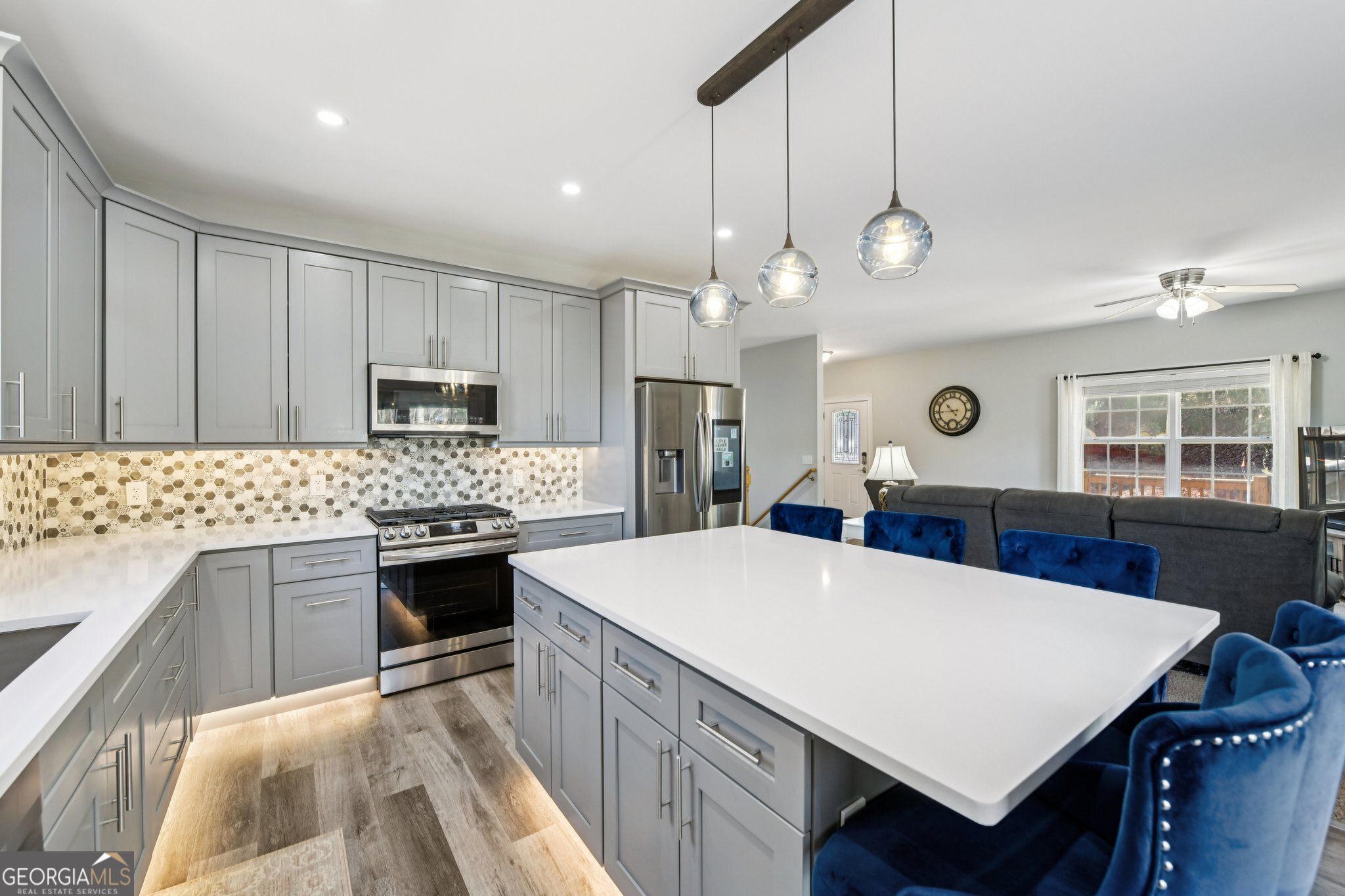 590 Ridge Road Dawsonville, GA 30534 - Photo 12 of 79 a large kitchen with granite countertop a stove a sink dishwasher a refrigerator a oven with white cabinets and wooden floor