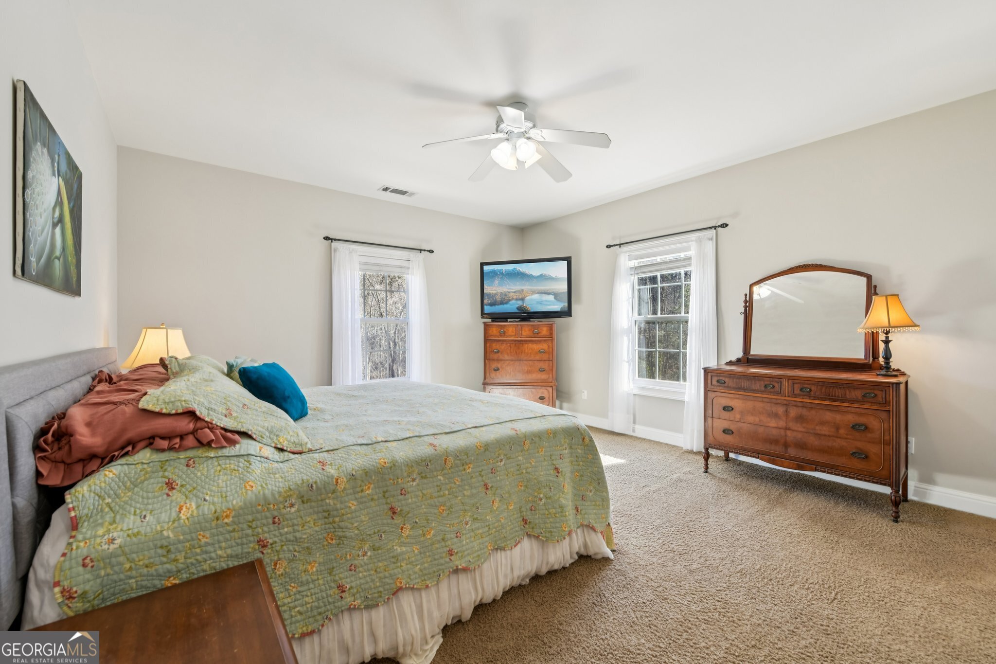 590 Ridge Road Dawsonville, GA 30534 - Photo 16 of 79 a bedroom with a bed and dresser