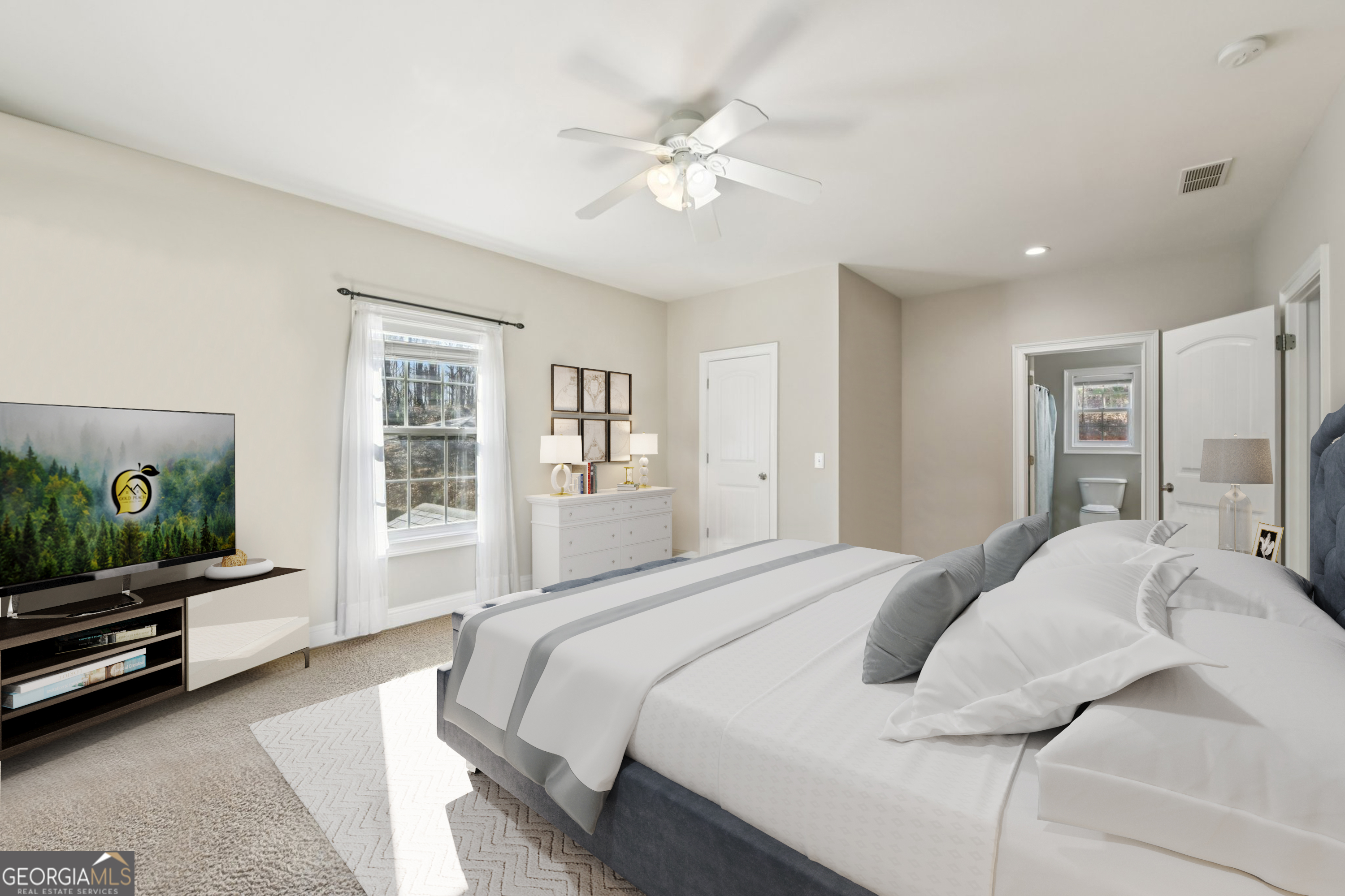 590 Ridge Road Dawsonville, GA 30534 - Photo 19 of 79 a spacious bedroom with a bed and a flat screen tv