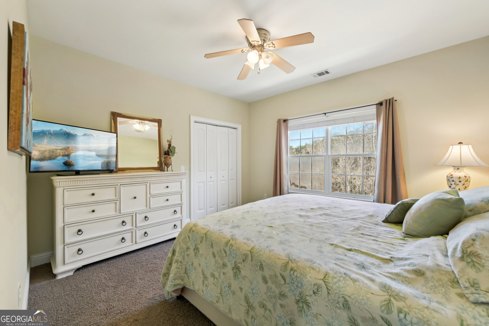590 Ridge Road Dawsonville, GA 30534 - Photo 23 of 79 a bedroom with a bed a window and dresser