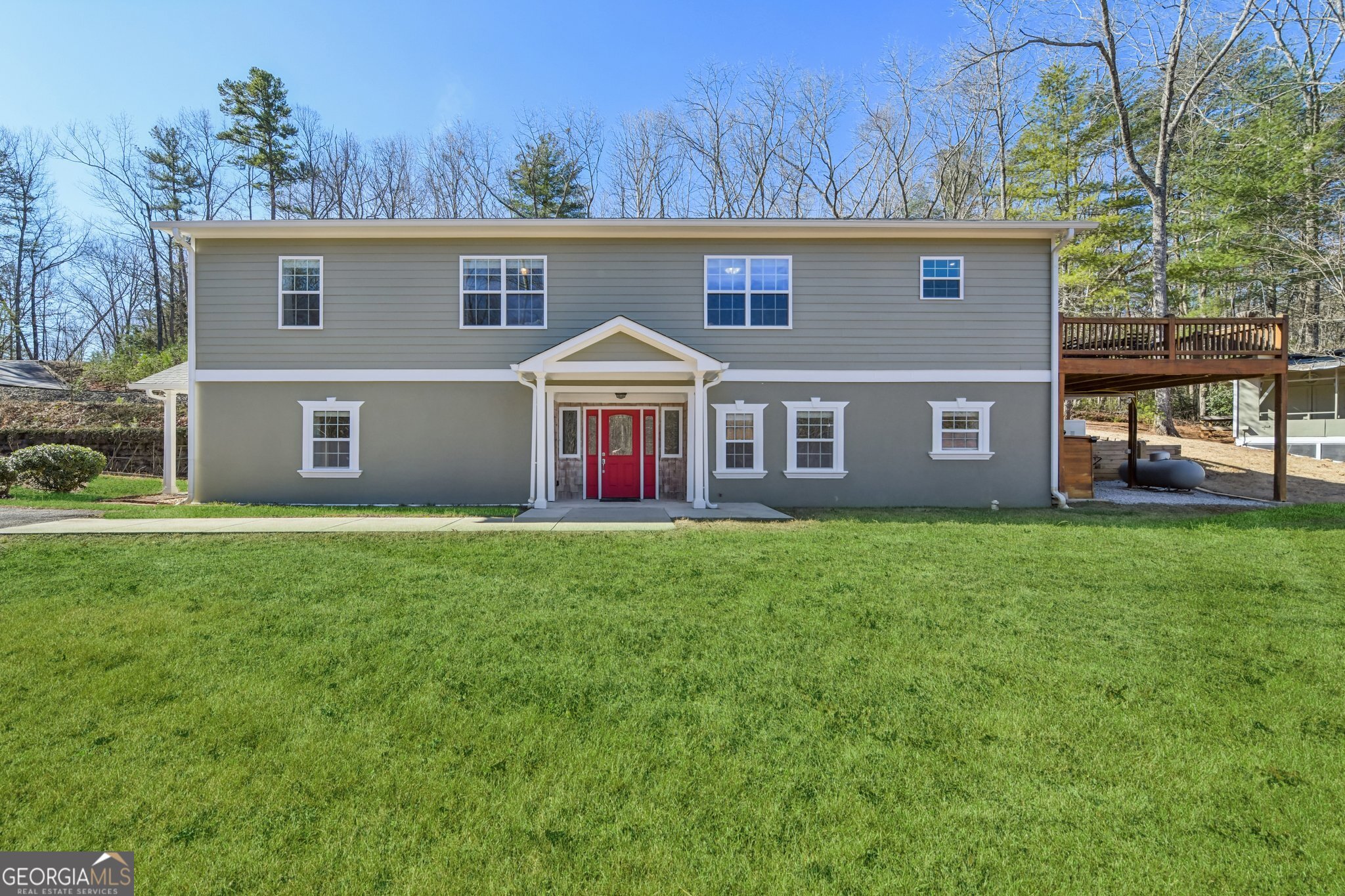 590 Ridge Road Dawsonville, GA 30534 - Photo 52 of 79 a front view of a house with garden