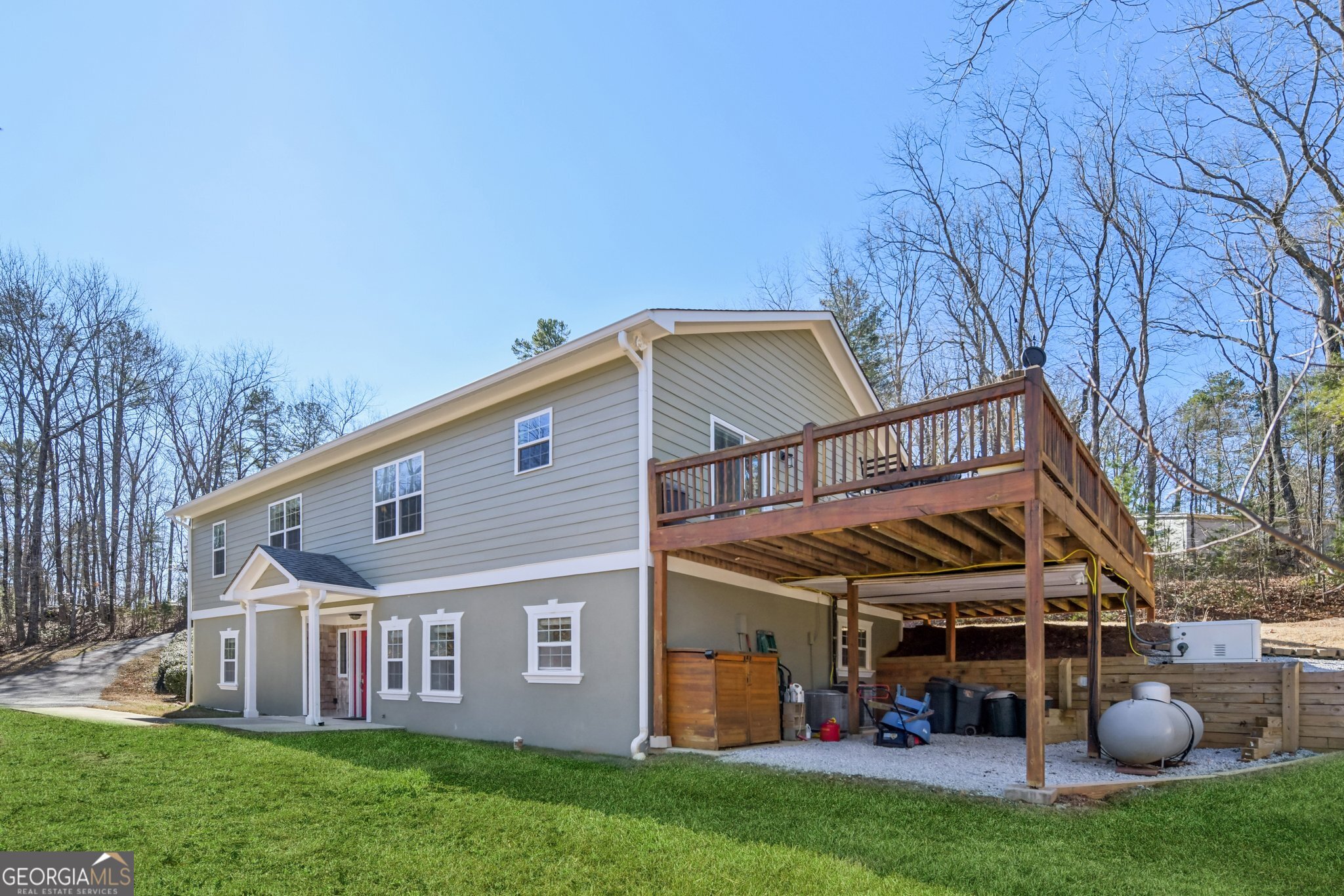 590 Ridge Road Dawsonville, GA 30534 - Photo 54 of 79 a view of a house with backyard porch and sitting area