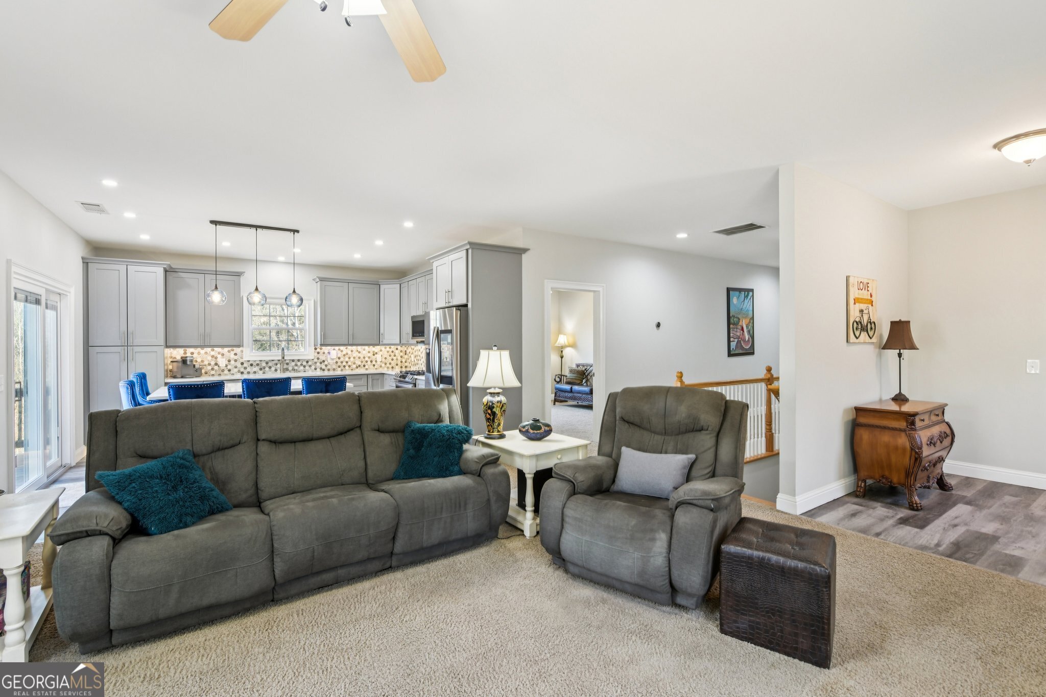 590 Ridge Road Dawsonville, GA 30534 - Photo 6 of 79 a living room with furniture and a chandelier