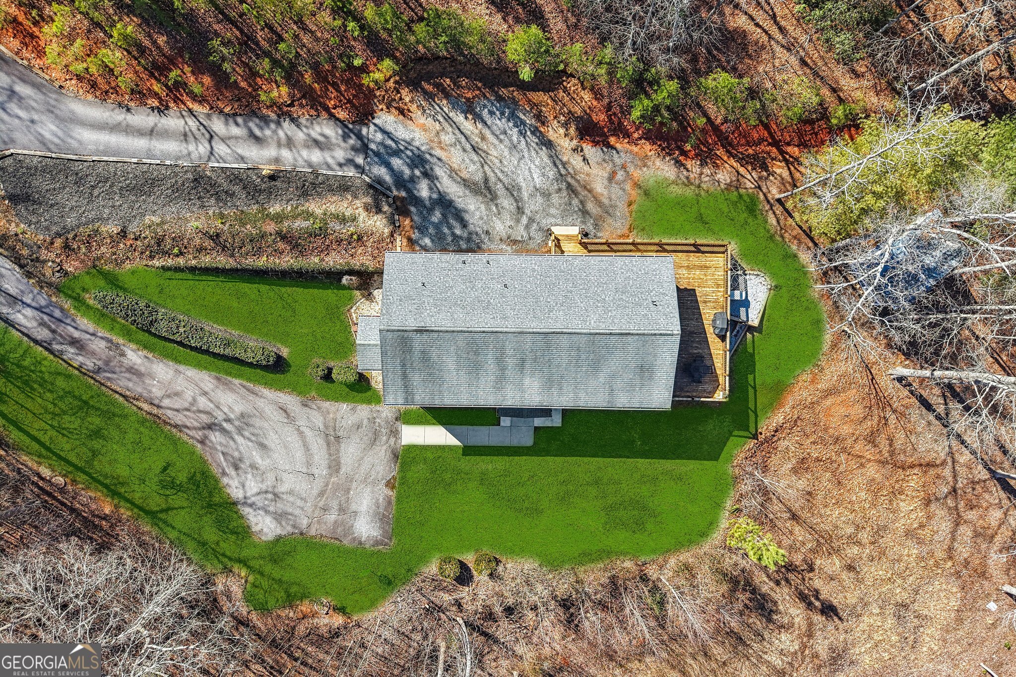 590 Ridge Road Dawsonville, GA 30534 - Photo 65 of 79 a front view of a house with a garden and yard