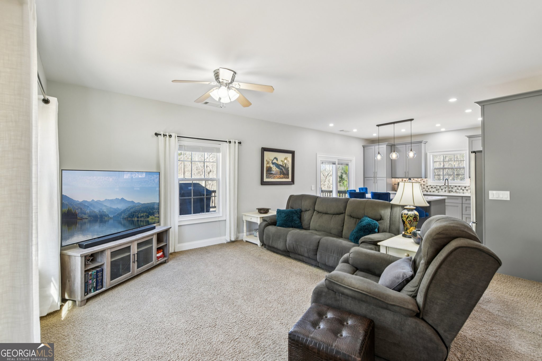 590 Ridge Road Dawsonville, GA 30534 - Photo 7 of 79 a living room with furniture and a flat screen tv