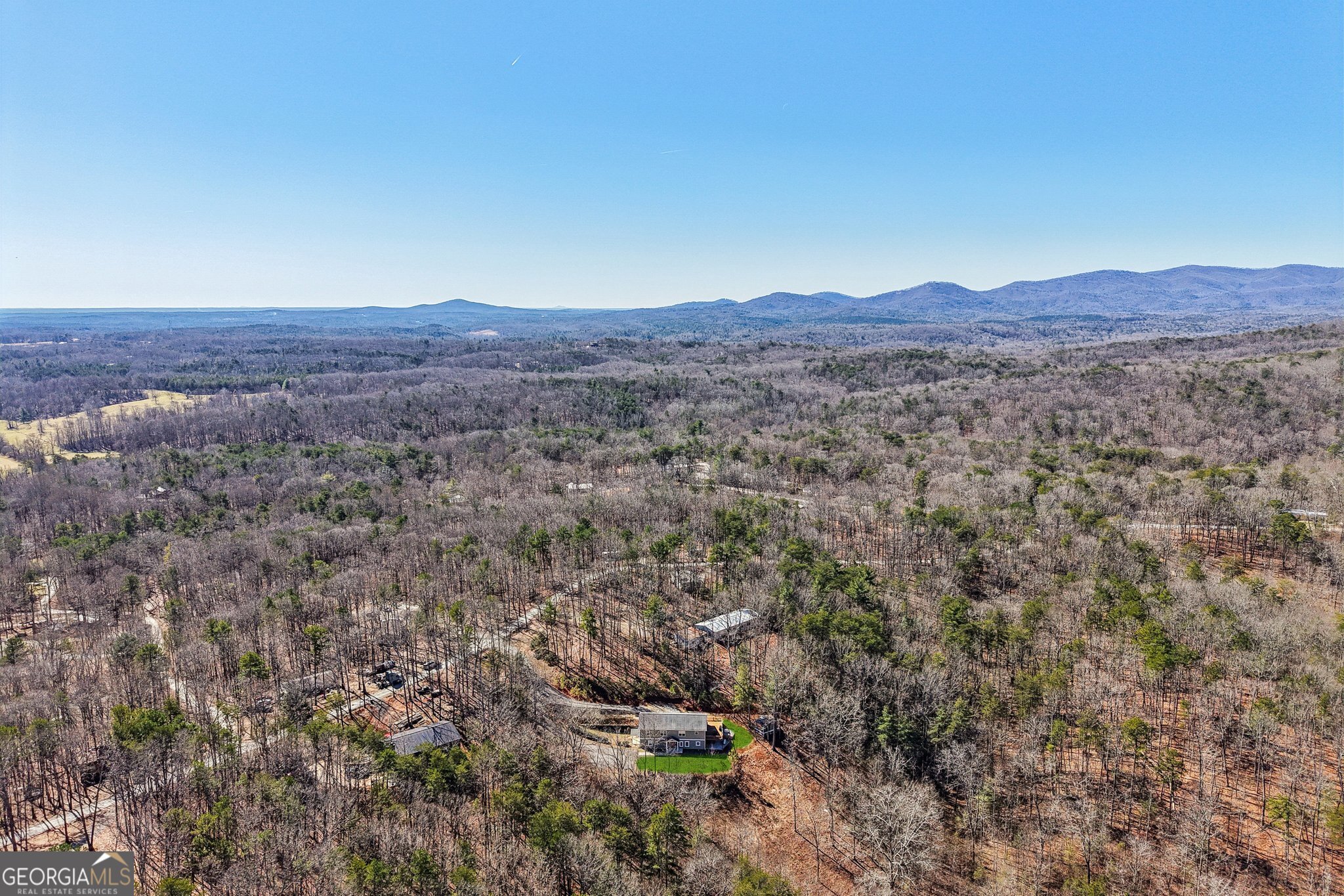 590 Ridge Road Dawsonville, GA 30534 - Photo 73 of 79 a view of a lush green field with mountains in the background