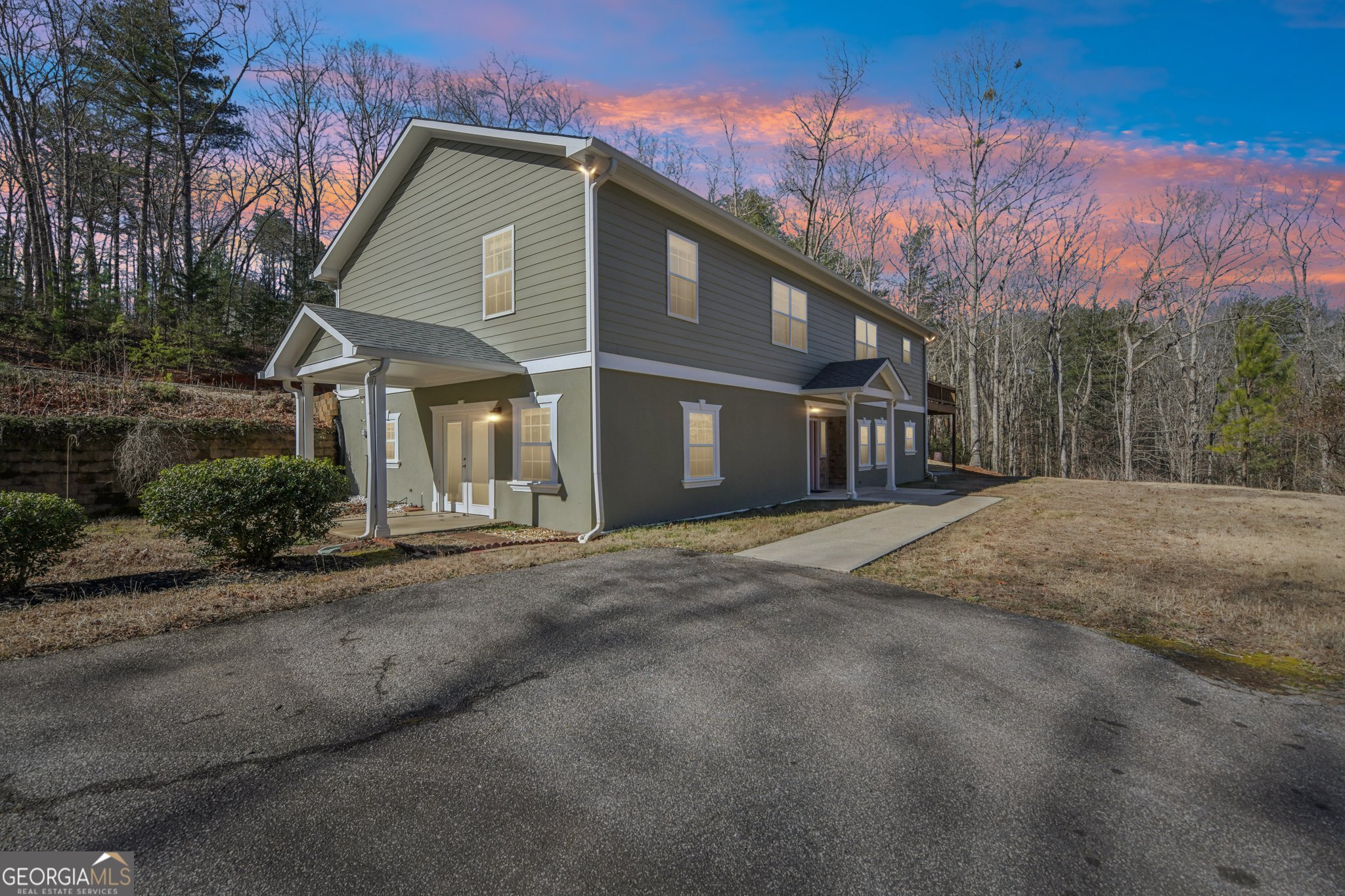 590 Ridge Road Dawsonville, GA 30534 - Photo 76 of 79 a front view of a house with a yard and garage