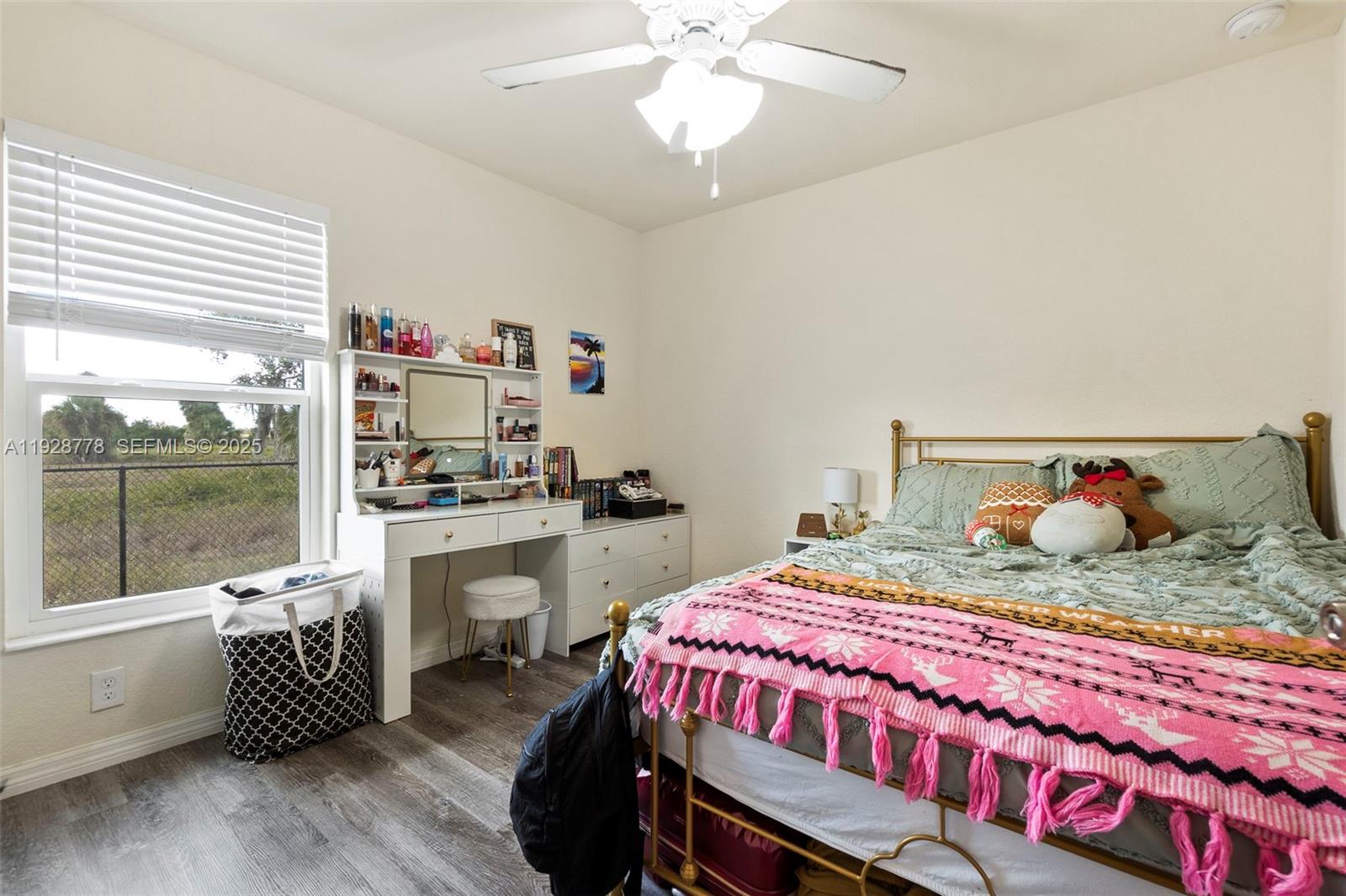 3019 Honeywood Road LaBelle, FL 33935 - Photo 12 of 18 a bedroom with a bed and a table