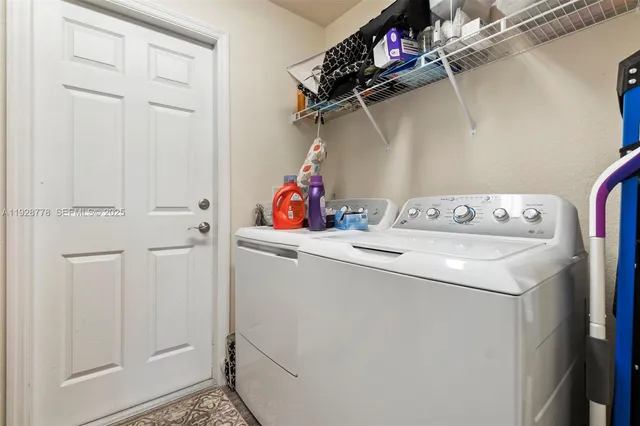 a utility room with dryer and washer