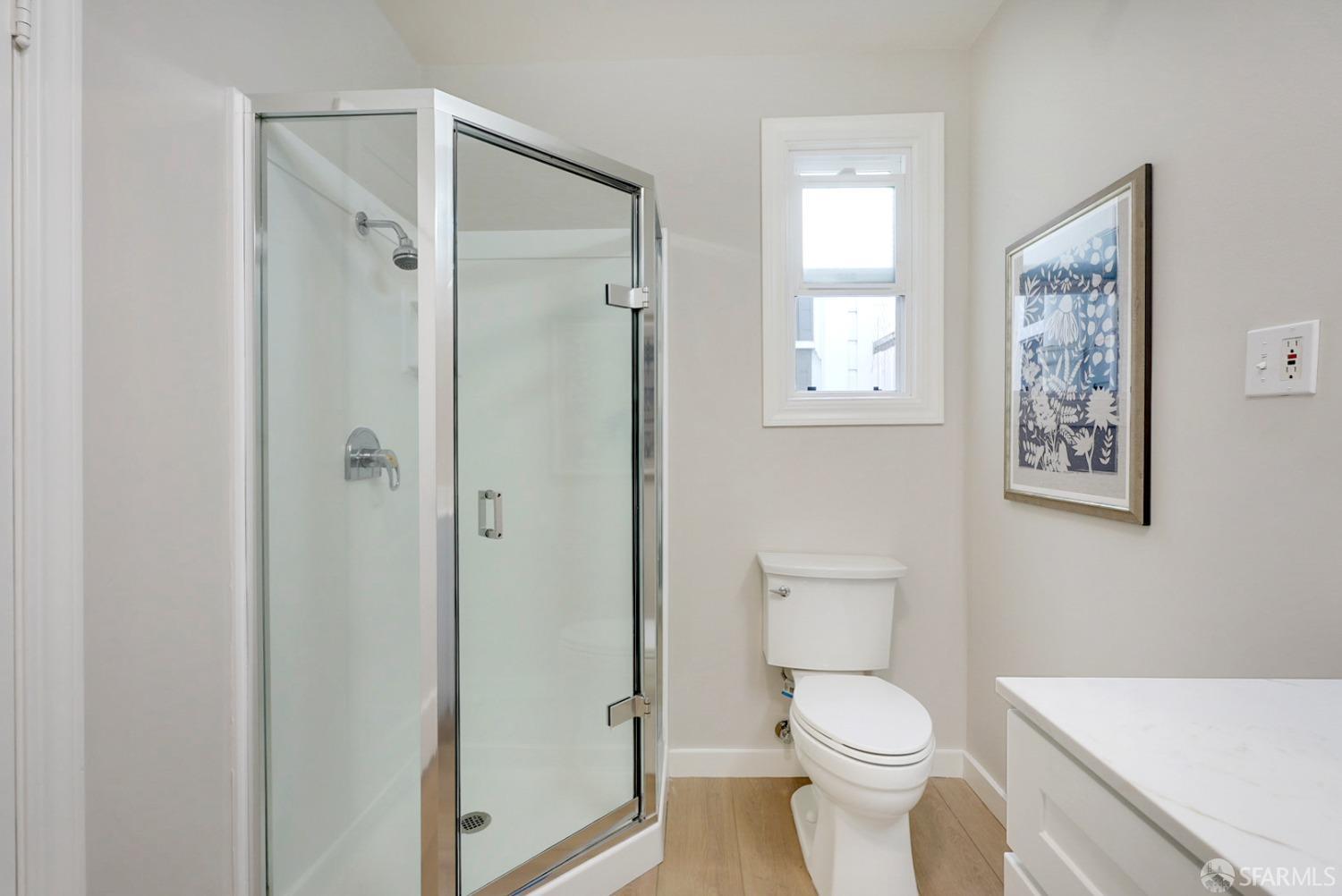 1674 25th Avenue San Francisco, CA 94122 - Photo 13 of 42 a white toilet sitting next to a bathroom sink