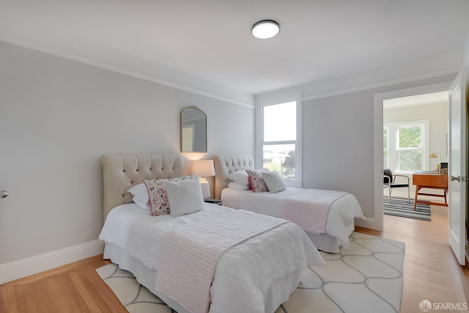 1674 25th Avenue San Francisco, CA 94122 - Photo 14 of 42 a bedroom with two beds and a couch