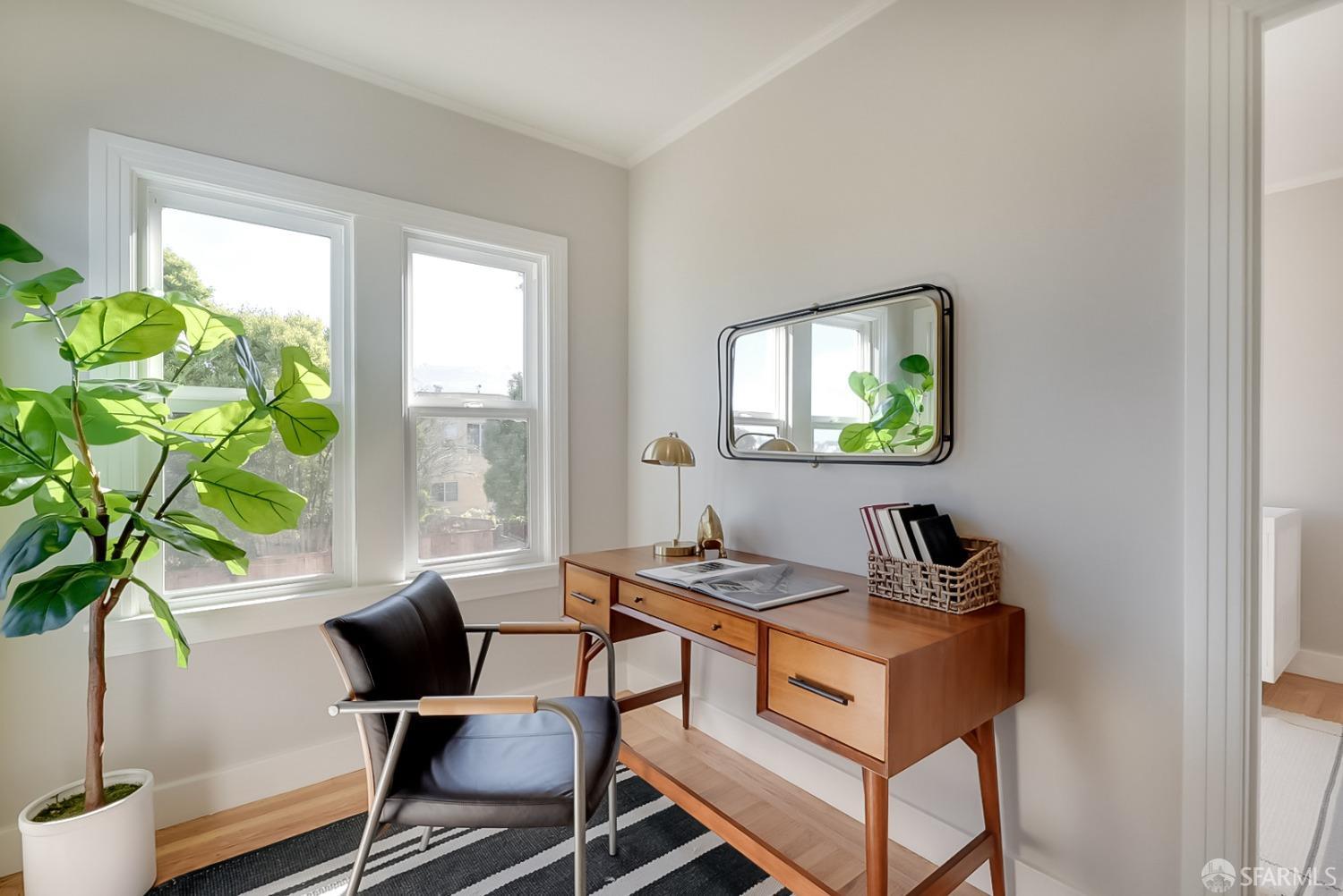 1674 25th Avenue San Francisco, CA 94122 - Photo 19 of 42 a living room with furniture and a potted plant