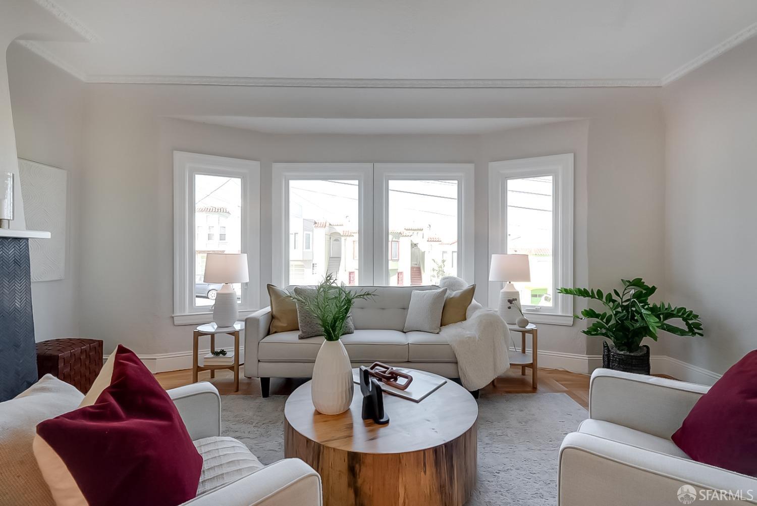1674 25th Avenue San Francisco, CA 94122 - Photo 2 of 42 a living room with furniture and a large window