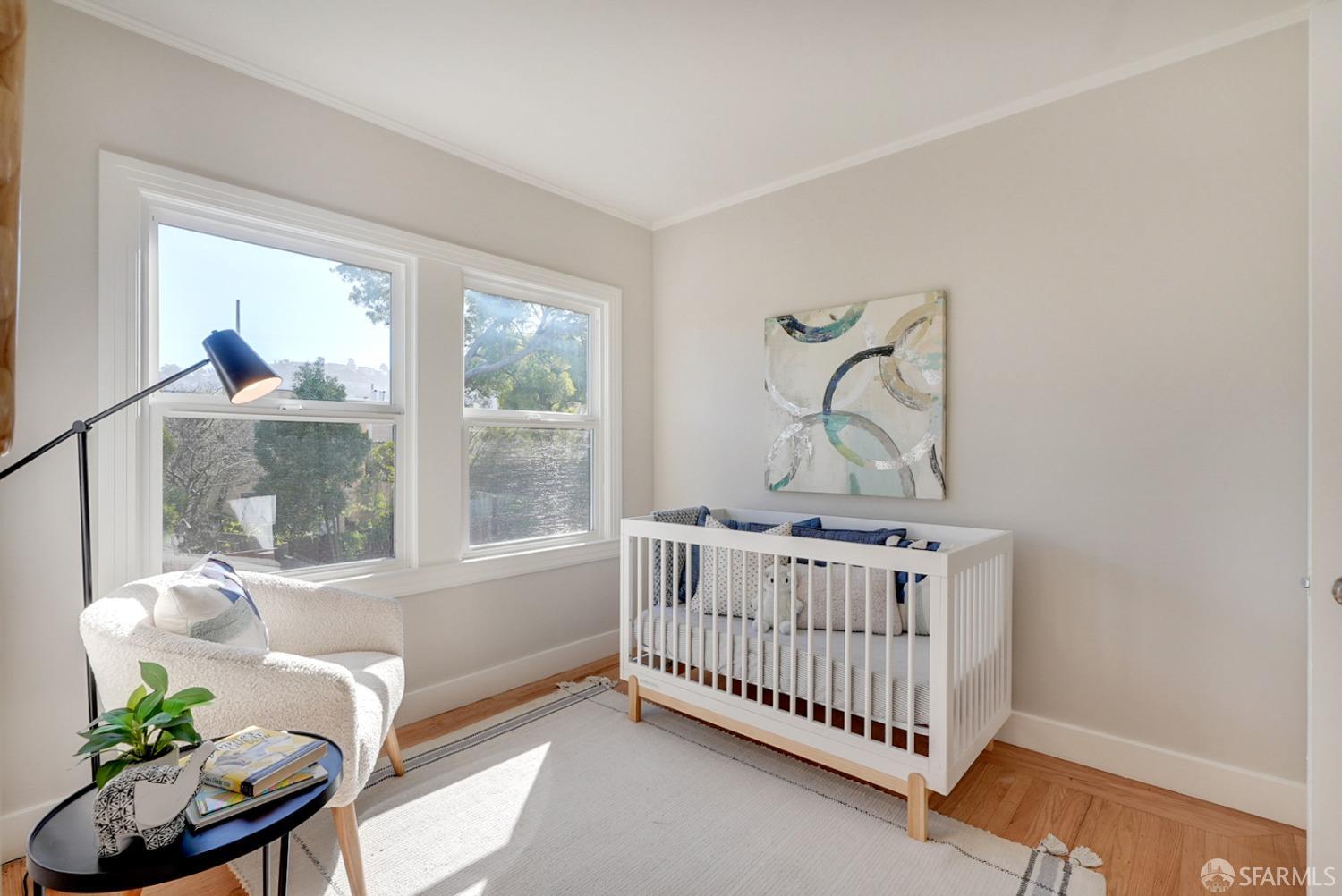 1674 25th Avenue San Francisco, CA 94122 - Photo 21 of 42 a bedroom with a bed and a window