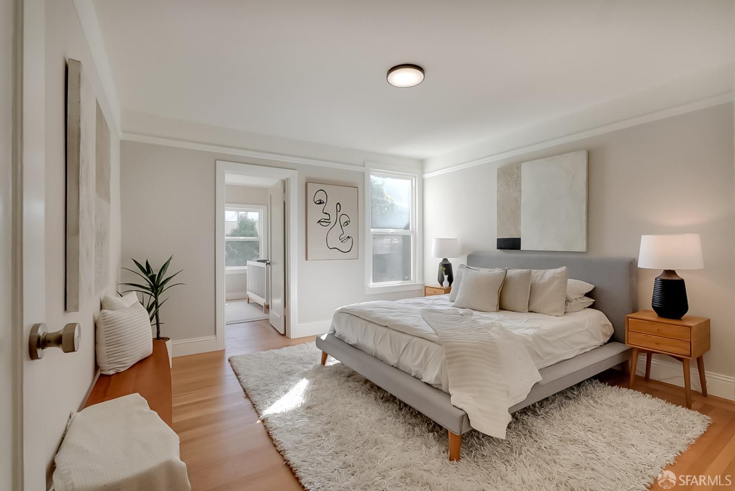 1674 25th Avenue San Francisco, CA 94122 - Photo 22 of 42 a bedroom with a large bed couch and windows