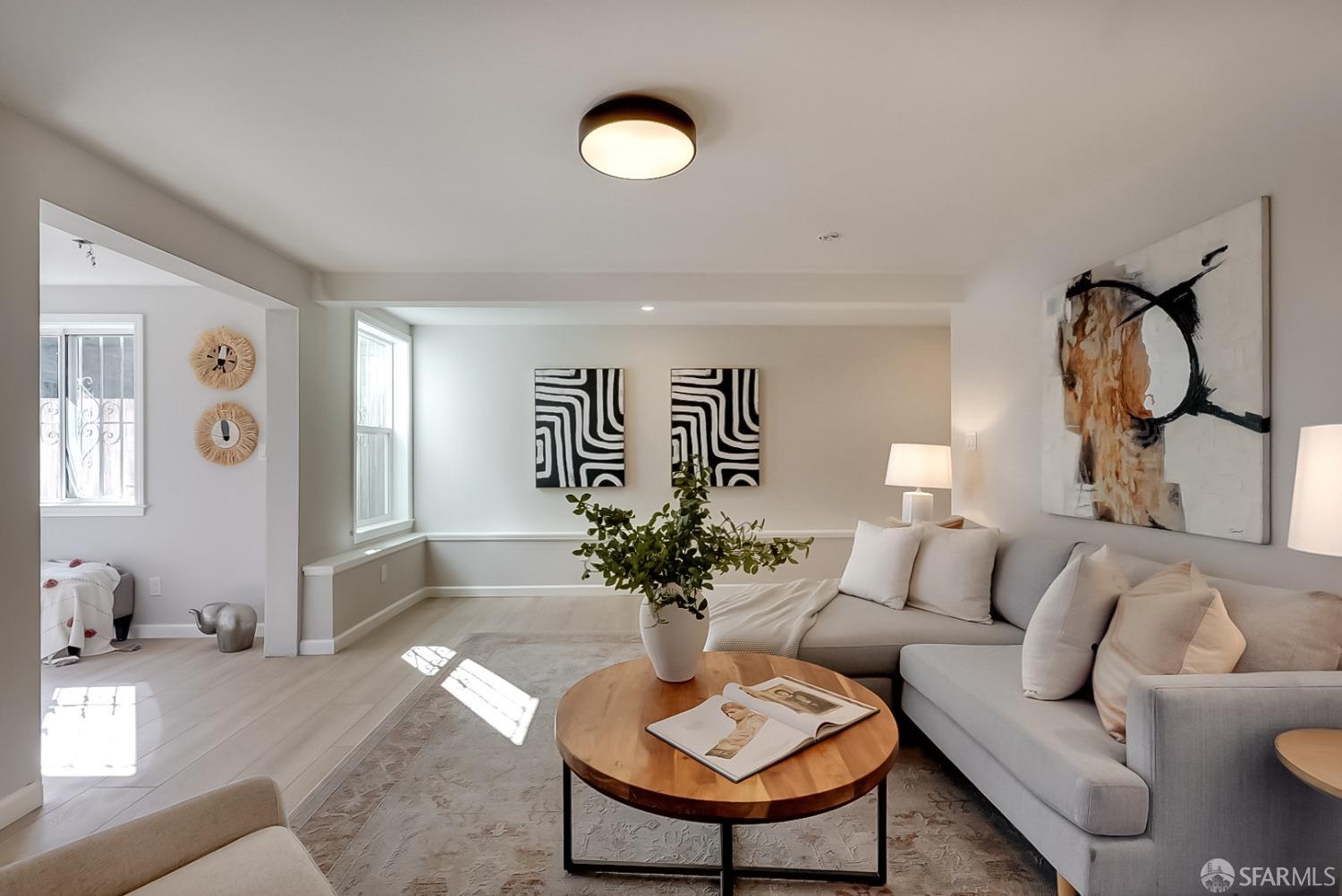 1674 25th Avenue San Francisco, CA 94122 - Photo 25 of 42 a living room with furniture flowerpot and a mirror