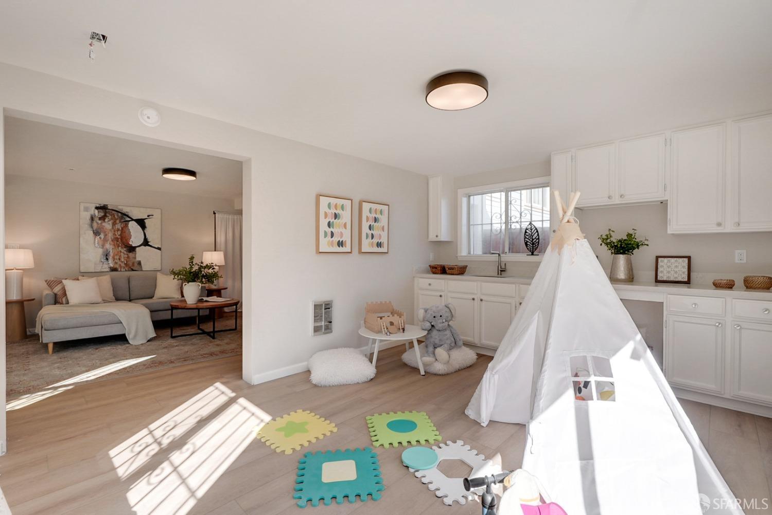 1674 25th Avenue San Francisco, CA 94122 - Photo 29 of 42 a living room with furniture and a wooden floor