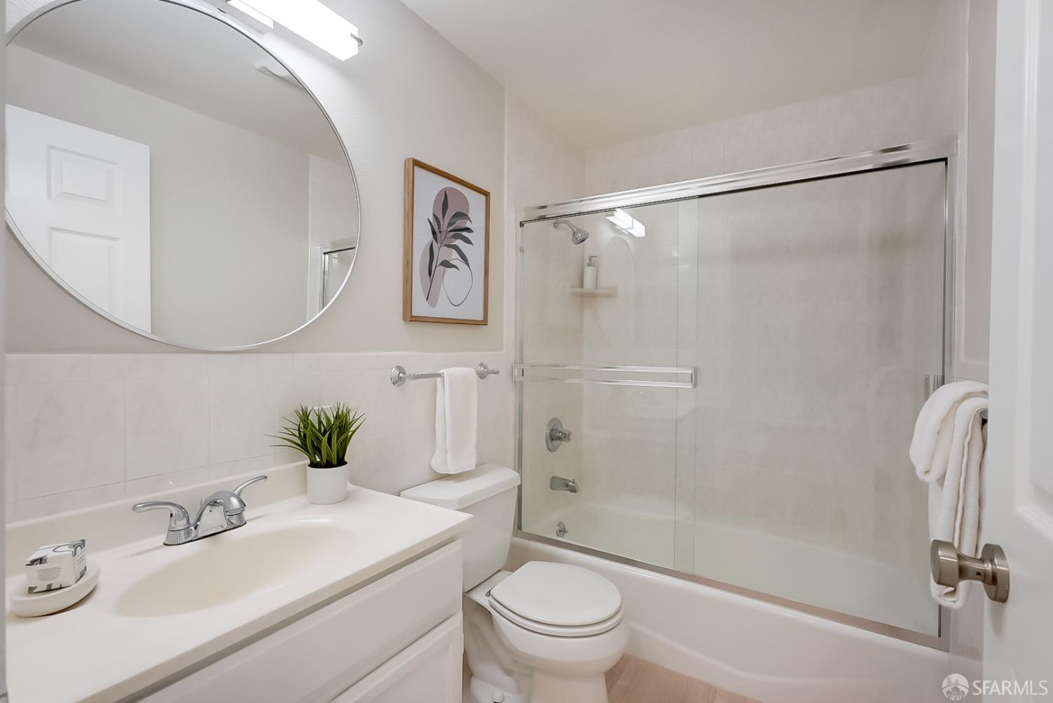 1674 25th Avenue San Francisco, CA 94122 - Photo 30 of 42 a bathroom with a sink toilet and shower