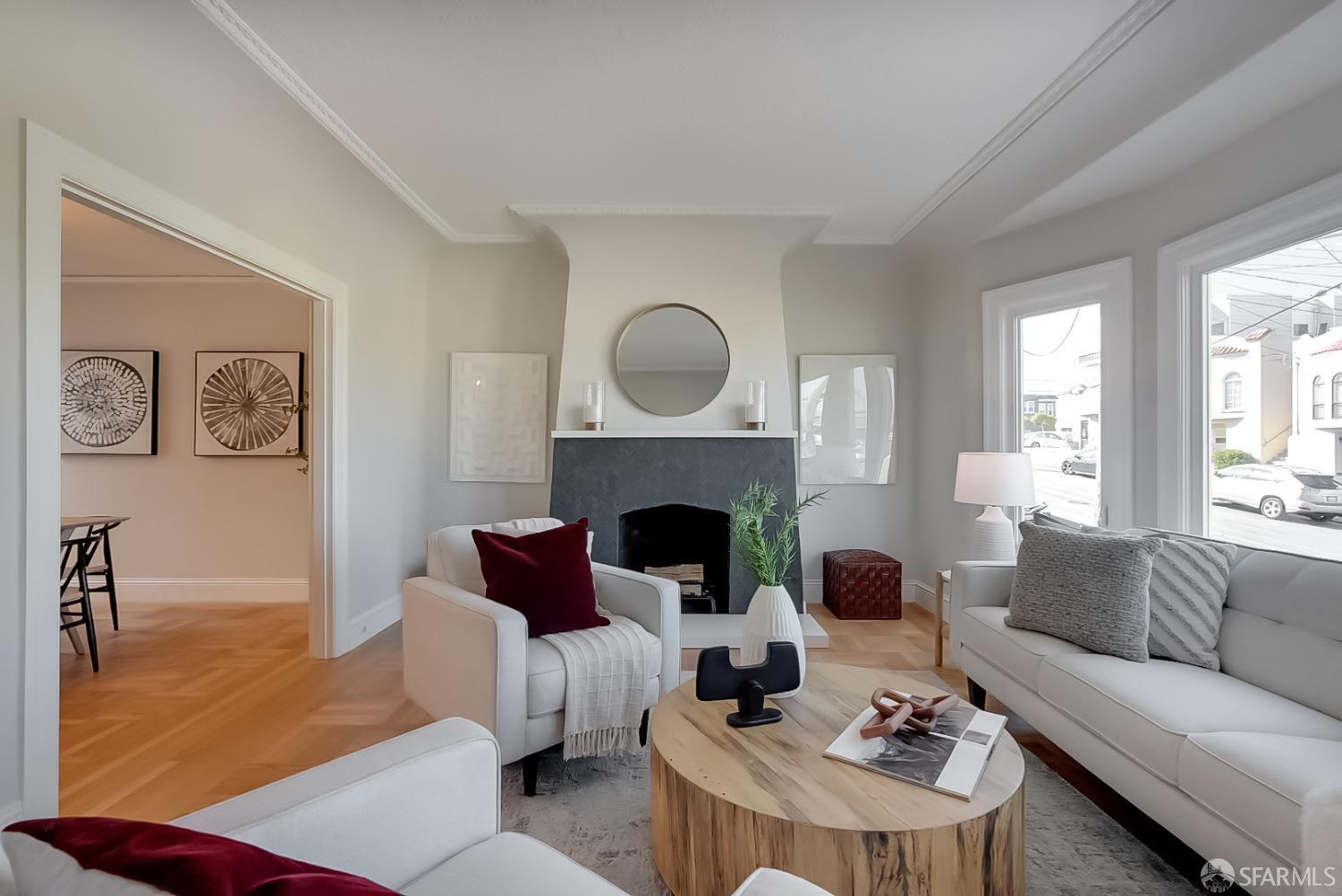 1674 25th Avenue San Francisco, CA 94122 - Photo 3 of 42 a living room with furniture and a fireplace