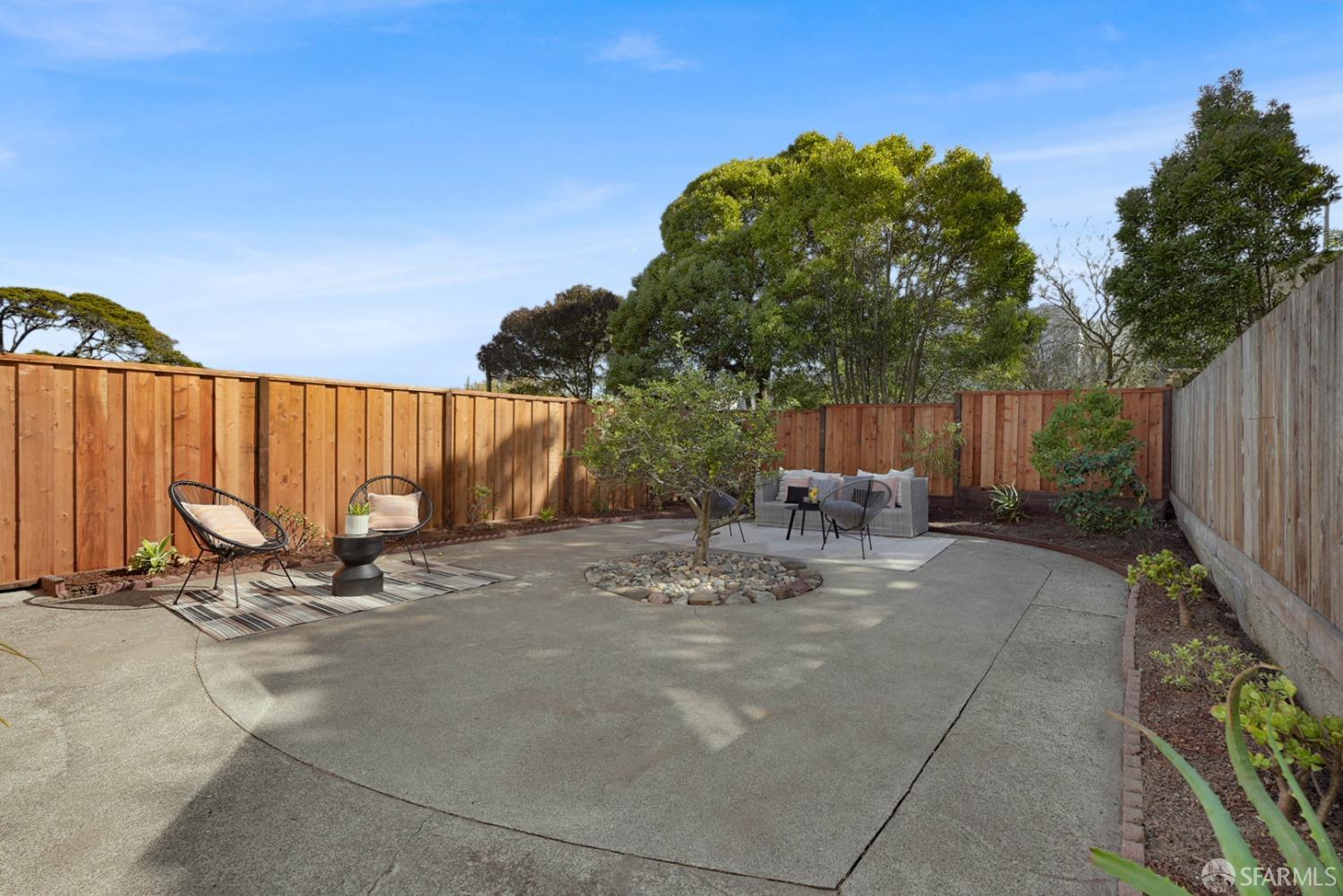 1674 25th Avenue San Francisco, CA 94122 - Photo 32 of 42 a view of backyard with a table and chairs