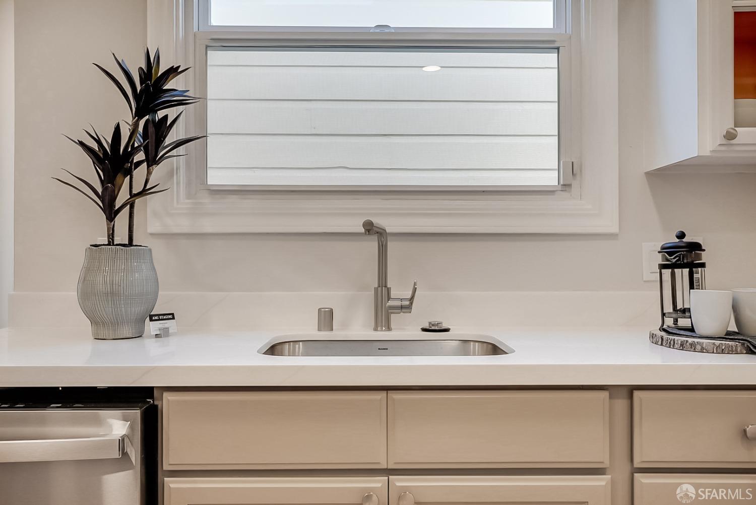 1674 25th Avenue San Francisco, CA 94122 - Photo 10 of 42 a bathroom with a sink and a potted plant