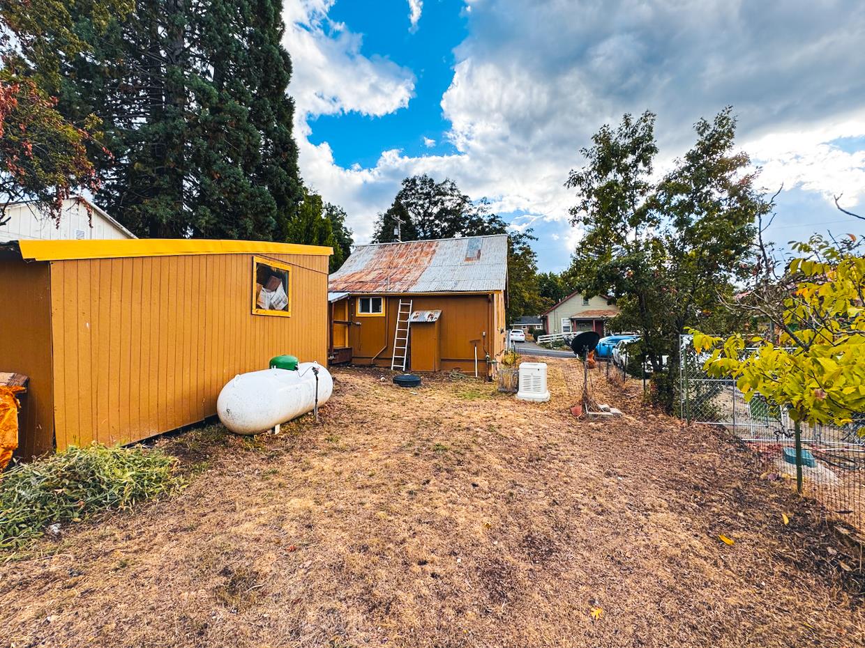 108 Pine Street West Point, CA 95255 - Photo 12 of 17 a view of a house with a backyard