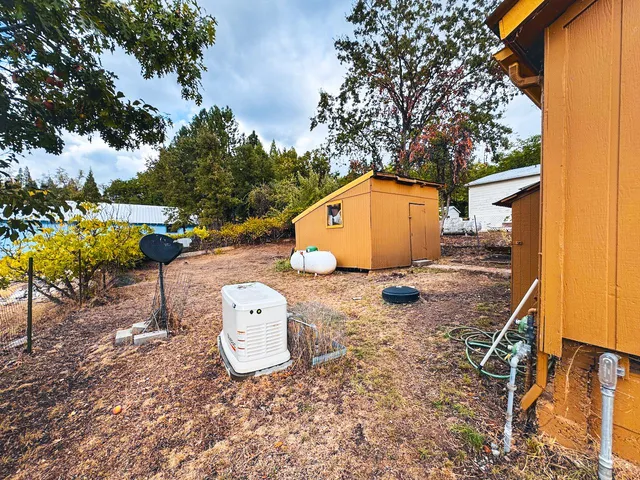 an aerial view of a house with yard