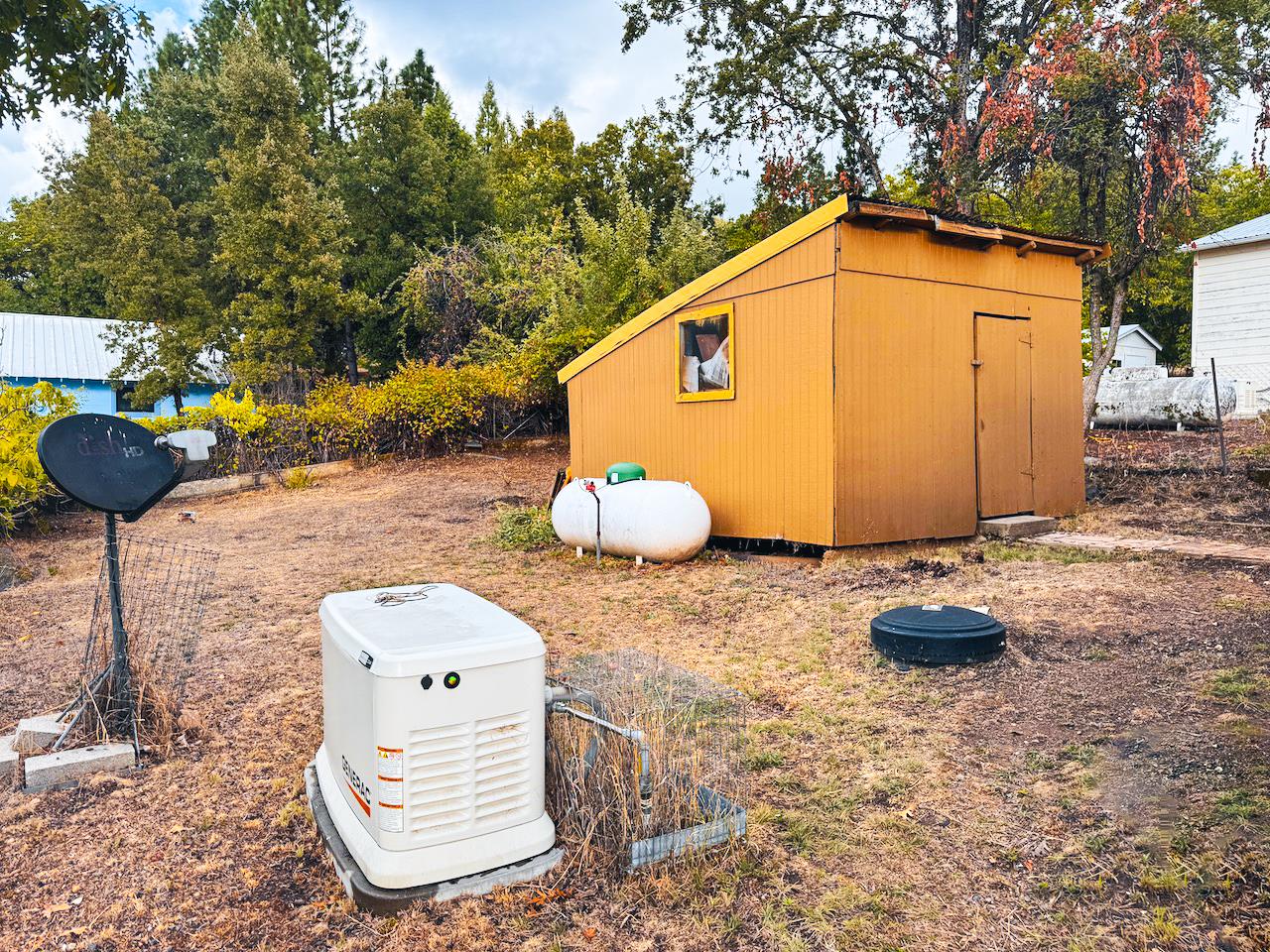 108 Pine Street West Point, CA 95255 - Photo 14 of 17 a backyard of a house with table and chairs