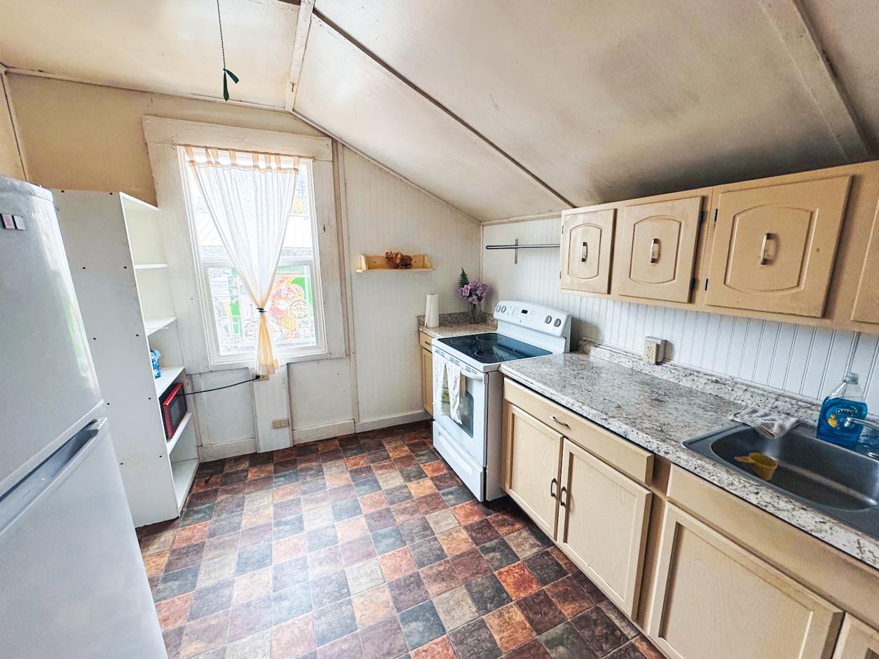 108 Pine Street West Point, CA 95255 - Photo 6 of 17 a kitchen with stainless steel appliances granite countertop a sink stove and cabinets
