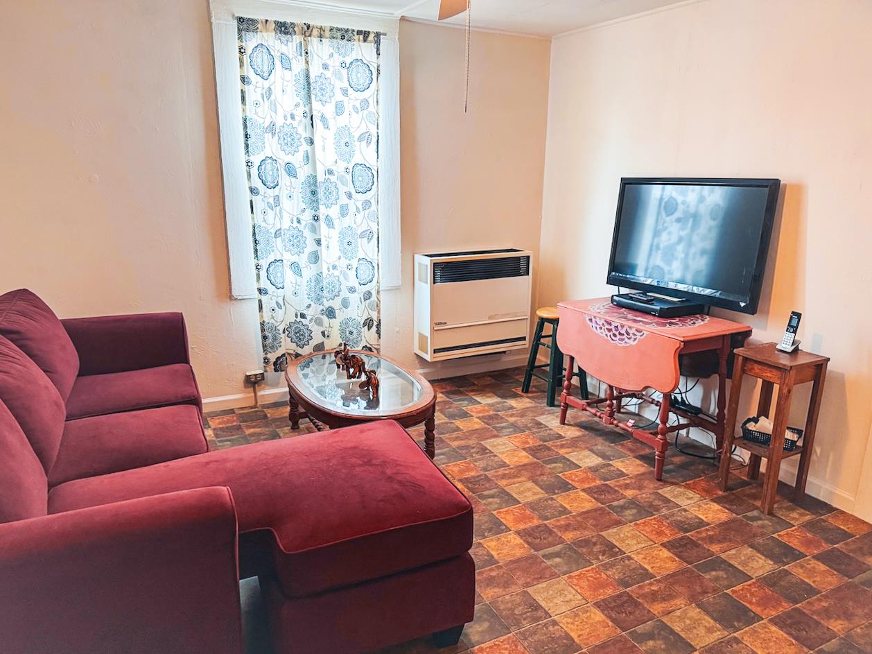 108 Pine Street West Point, CA 95255 - Photo 10 of 17 a bedroom with furniture and a rug