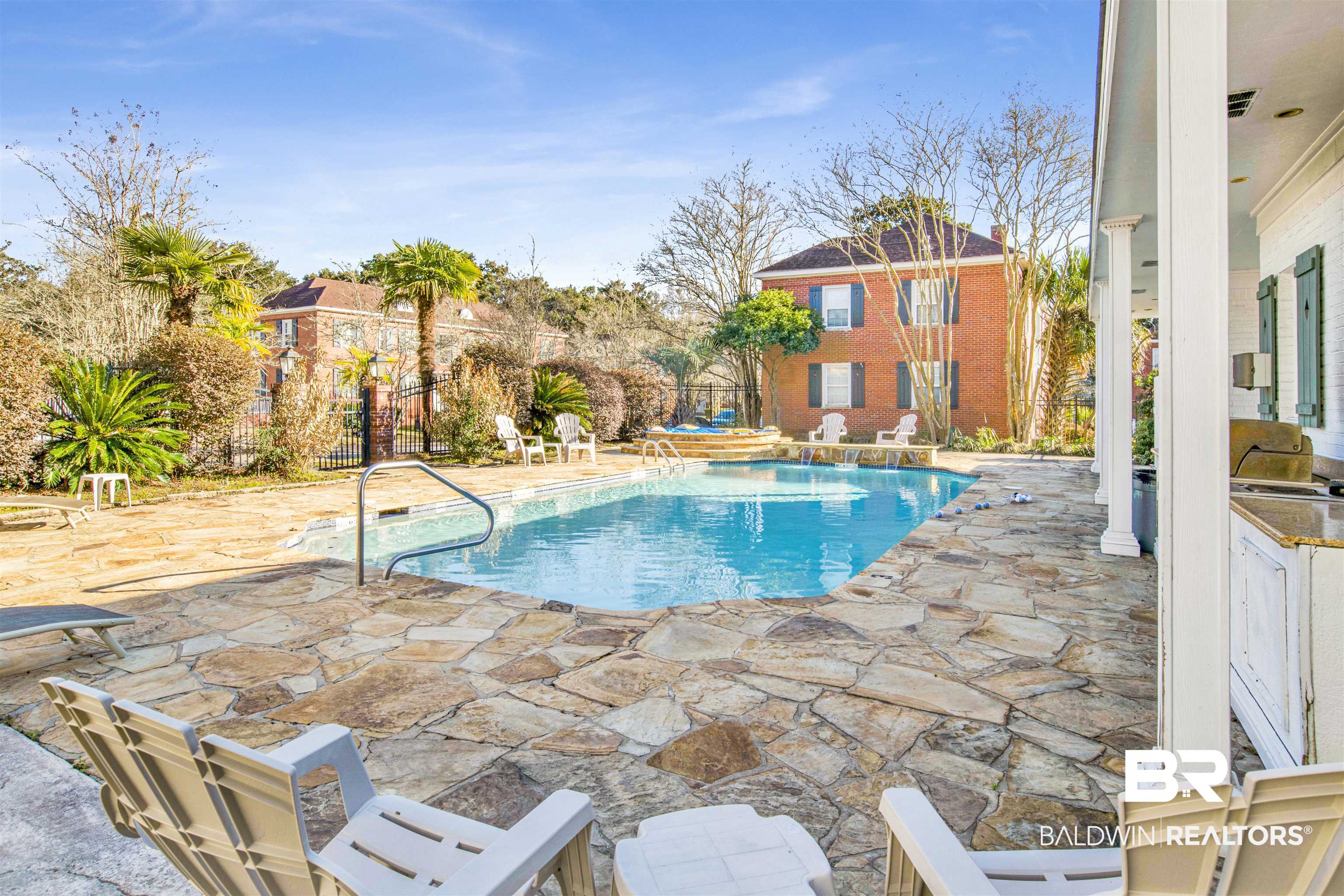 214 Upham Street, Unit 7A Mobile, AL 36607 - Photo 30 of 35 View of pool featuring a patio area and exterior kitchen
