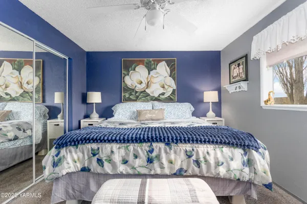 a bedroom with a bed and window