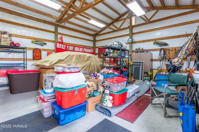 a bathroom with a granite countertop sink toilet a mirror and shower
