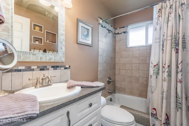 a bedroom with bed and window