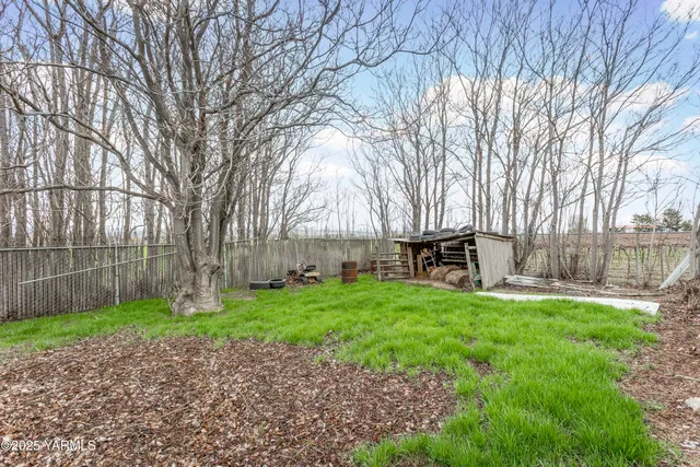 a view of a swimming pool and a yard