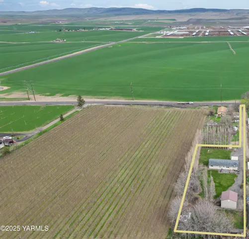 a view of a big yard with an outdoor space