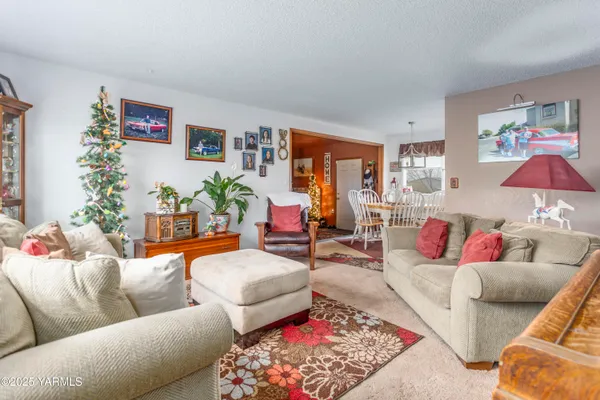 a living room with furniture and a rug