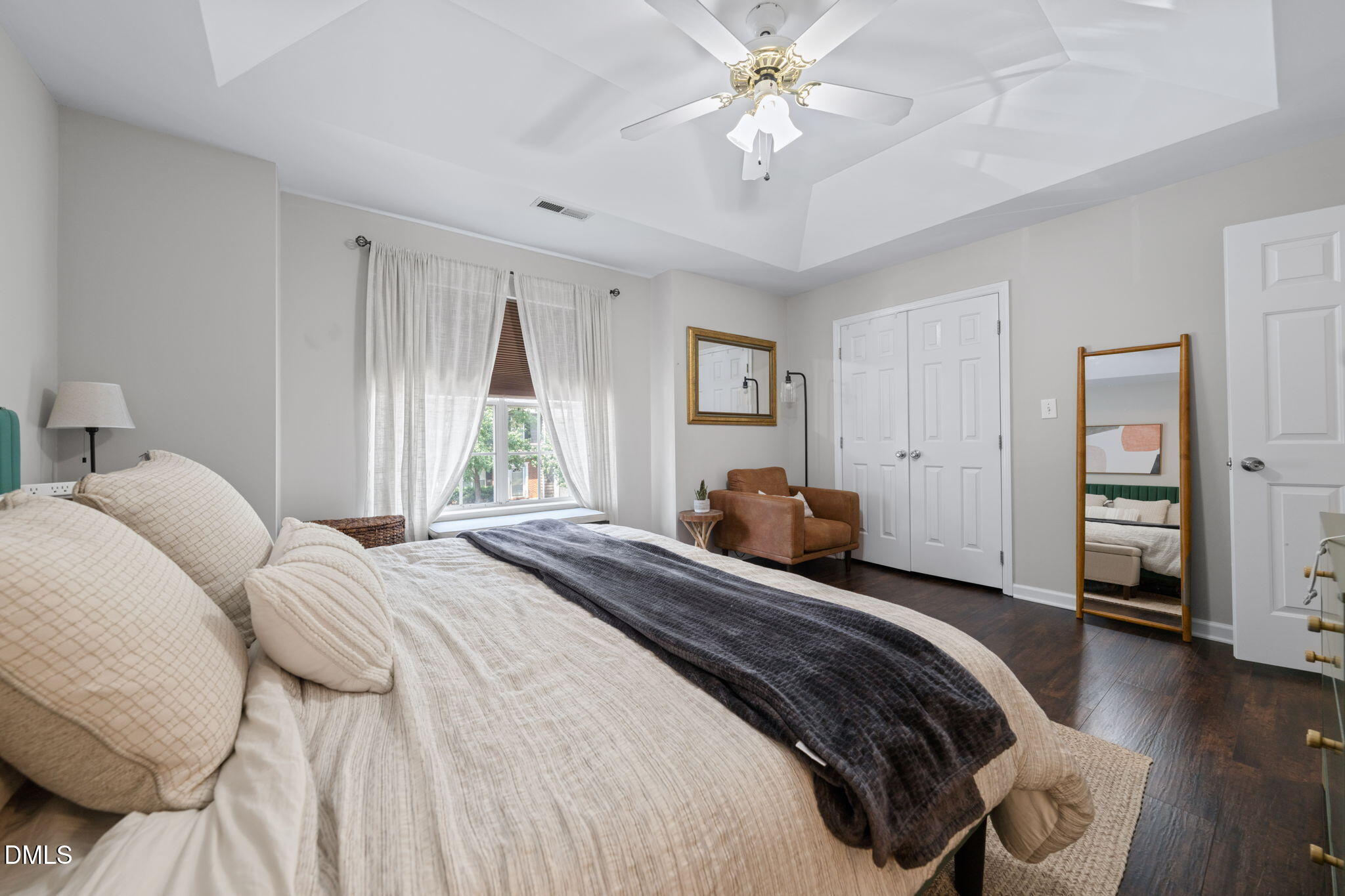 4323 Pine Springs Court Raleigh, NC 27613 - Photo 28 of 38 a bedroom with a bed and a chandelier