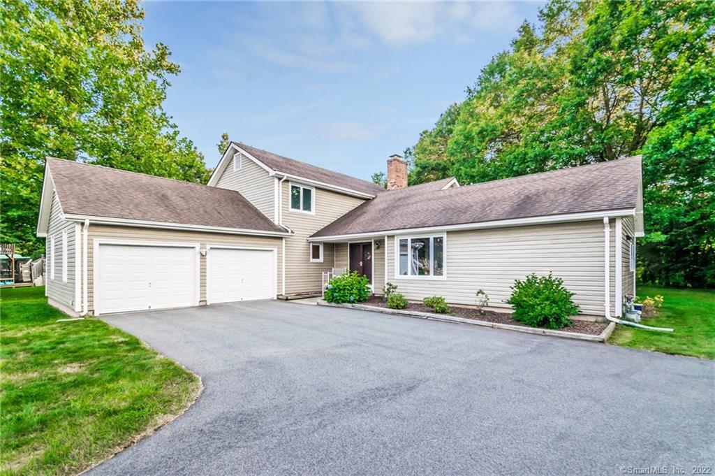 30 High Ridge Road Cromwell, CT 06416 - Photo 1 of 1 a front view of a house with a yard and garage