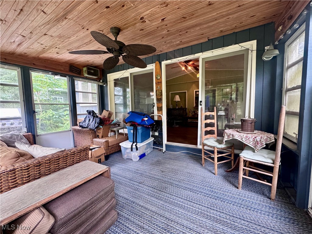 1470 South Riverview Road Stockport, OH 43787 - Photo 8 of 24 Sunroom / solarium with plenty of natural light, a ceiling fan, and an outdoor living space