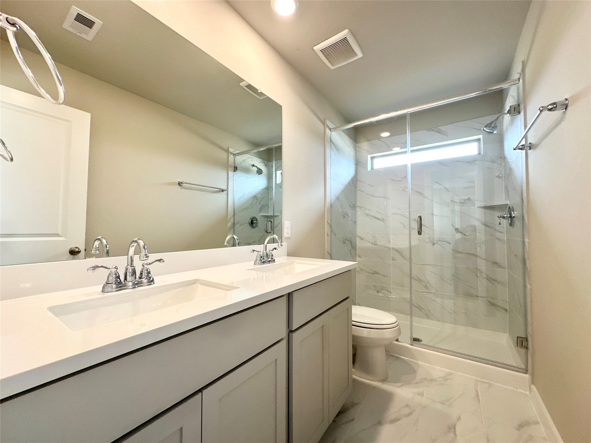 12198 Ridge Top Drive Conroe, TX 77304 - Photo 13 of 27 a bathroom with a sink a toilet and shower