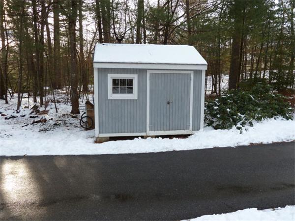 99 Maynard Farm Road Sudbury, MA 01776 - Photo 25 of 28 a view of a house with a yard
