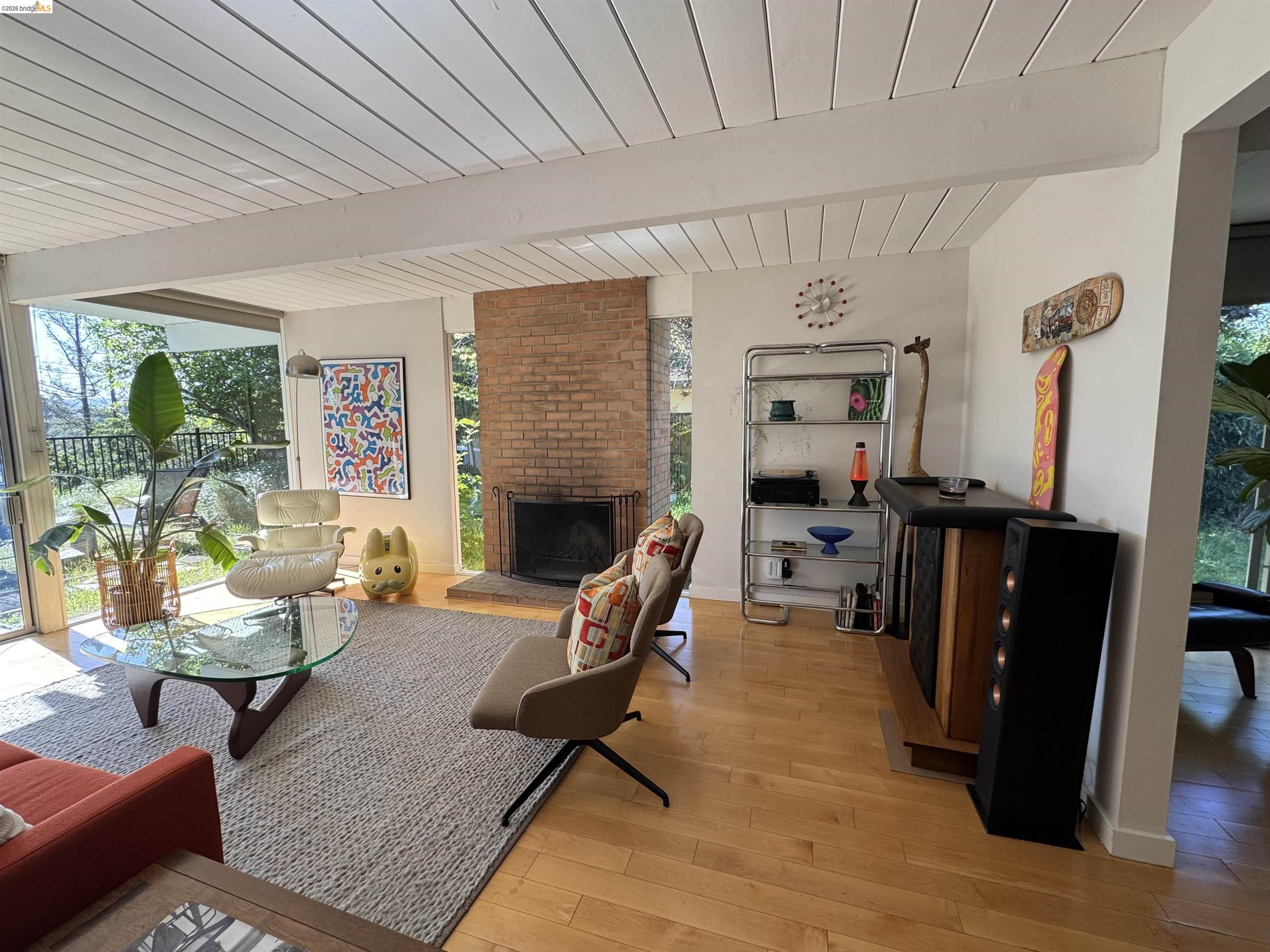 a living room with furniture rug and a fireplace