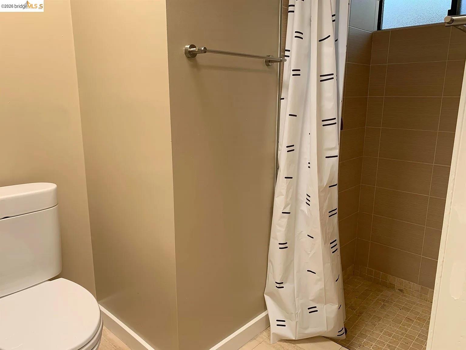 5559 Greenridge Road Castro Valley, CA 94552 - Photo 17 of 33 Full bathroom featuring a stall shower and toilet