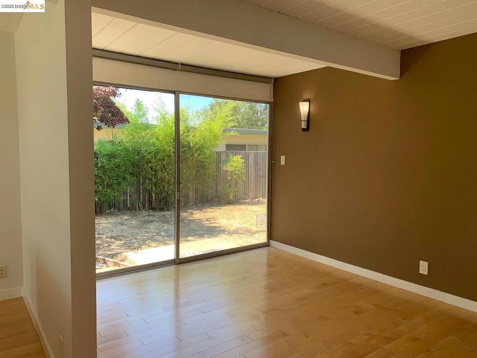 5559 Greenridge Road Castro Valley, CA 94552 - Photo 23 of 33 Unfurnished room featuring beam ceiling and light wood-style floors