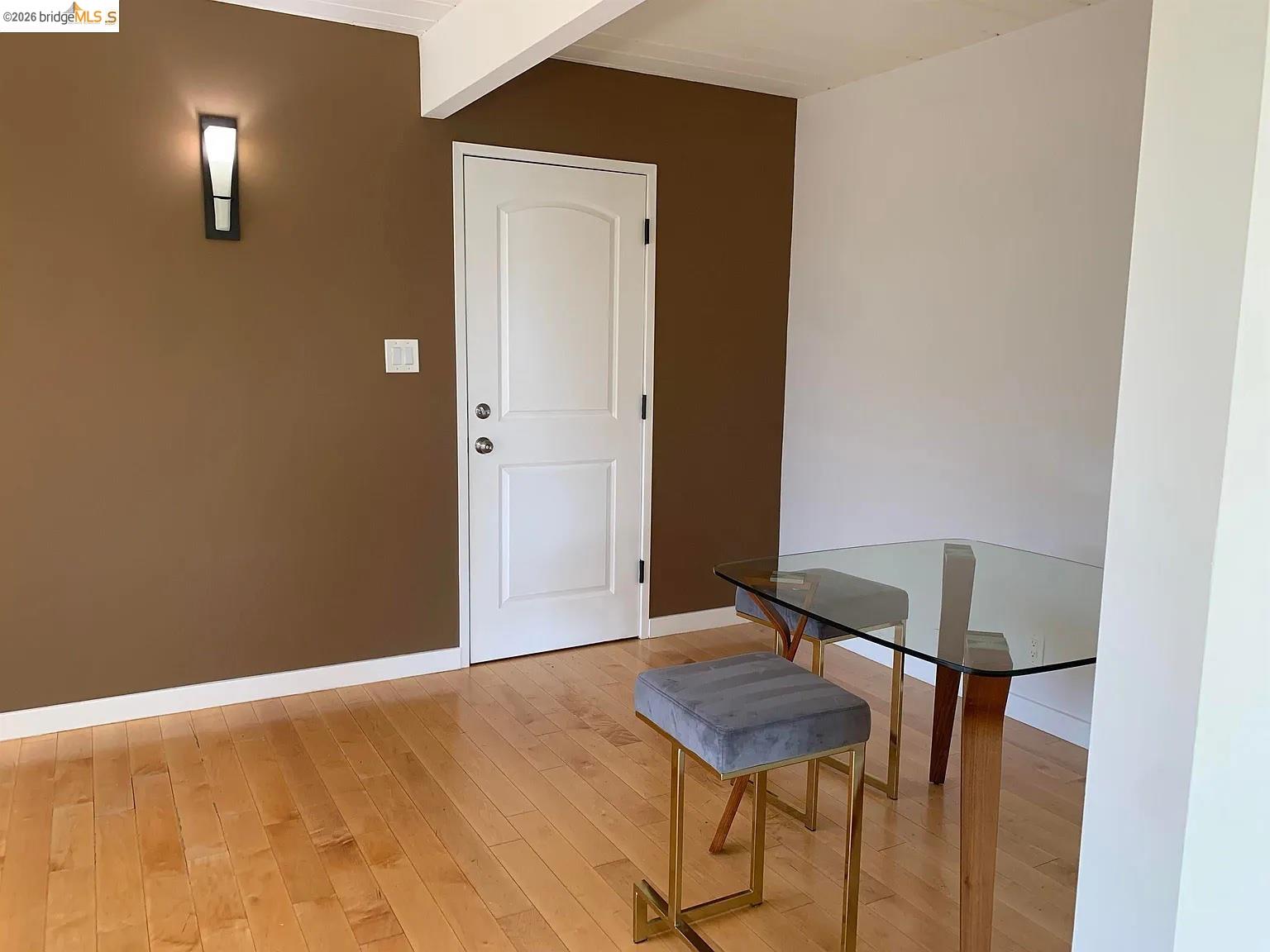 5559 Greenridge Road Castro Valley, CA 94552 - Photo 24 of 33 Dining room with beamed ceiling and light wood-style flooring